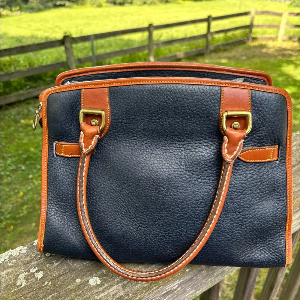 Dooney and Bourke Classic Black and Tan Vintage Leather Handbag